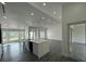 Open-concept kitchen and living area with a large island, recessed lighting, and access to the patio at 200 Dolphin Pkwy, Punta Gorda, FL 33950