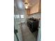 Laundry room with washer, dryer, and storage shelves at 200 Dolphin Pkwy, Punta Gorda, FL 33950
