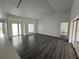 Spacious and open-concept living room, bathed in natural light, is modern and uncluttered at 200 Dolphin Pkwy, Punta Gorda, FL 33950