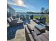 Outdoor patio furniture and grill setup in a large backyard at 2201 Grand Flora Trl, Bradenton, FL 34208