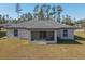 House with screened porch and backyard at 2364 Hagerick Ln, North Port, FL 34288