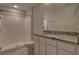 Bathroom boasts granite countertop and a shower at 2364 Hagerick Ln, North Port, FL 34288