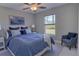 Cozy bedroom with a large window, chair, and a comfortable bed for a relaxing retreat at 2364 Hagerick Ln, North Port, FL 34288