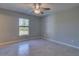 Simple bedroom with tile flooring and a window at 2364 Hagerick Ln, North Port, FL 34288