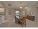 Open-concept dining room featuring a large table, buffet, and ample natural light from the window at 2364 Hagerick Ln, North Port, FL 34288