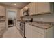 Modern kitchen features granite countertops and stainless steel appliances at 2364 Hagerick Ln, North Port, FL 34288