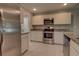 Kitchen with stainless steel appliances and white cabinets at 2364 Hagerick Ln, North Port, FL 34288