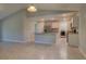 Open floorplan showcasing the kitchen area with a bar area and view into the laundry room at 2364 Hagerick Ln, North Port, FL 34288
