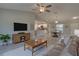 Spacious living room with modern finishes, opening to dining area and kitchen, perfect for entertaining at 2364 Hagerick Ln, North Port, FL 34288