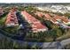 Community of townhouses with red tile roofs and lush landscaping at 240 W End Dr # 311, Punta Gorda, FL 33950