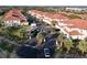 Aerial view of Magdalena Gardens community, showing the building layout and parking areas at 240 W End Dr # 311, Punta Gorda, FL 33950