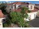 Aerial view of townhouse with tile roof and driveway at 240 W End Dr # 311, Punta Gorda, FL 33950
