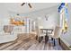 Dining area with wood-look floors and a view of the kitchen at 240 W End Dr # 311, Punta Gorda, FL 33950