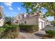 Tan townhome with white garage door and manicured hedges at 240 W End Dr # 311, Punta Gorda, FL 33950