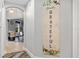 Hallway with decorative wall art and view to dining area at 240 W End Dr # 311, Punta Gorda, FL 33950