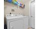 Laundry room with washer, dryer and shelving at 240 W End Dr # 311, Punta Gorda, FL 33950