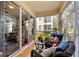 Comfortable sunroom with wicker seating and plenty of natural light at 240 W End Dr # 311, Punta Gorda, FL 33950