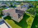 Back of house with a large backyard and a covered patio at 2507 Hobblebrush Dr, North Port, FL 34289