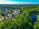 Aerial view of neighborhood with lake and houses at 2507 Hobblebrush Dr, North Port, FL 34289