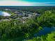 Aerial view of neighborhood with lake and houses at 2507 Hobblebrush Dr, North Port, FL 34289