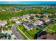 Aerial view of a neighborhood with houses and a lake at 2507 Hobblebrush Dr, North Port, FL 34289