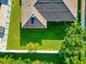 Backyard with large green lawn and privacy fence at 2507 Hobblebrush Dr, North Port, FL 34289