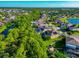 Aerial view of a house with solar panels and a pool at 2507 Hobblebrush Dr, North Port, FL 34289