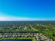 Aerial view of a community with numerous houses and lush green landscape at 2507 Hobblebrush Dr, North Port, FL 34289