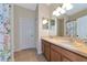 Clean bathroom with double sinks, tile floor, and shower at 2507 Hobblebrush Dr, North Port, FL 34289
