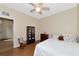 Bedroom with double bed, wood floors, and rocking chair at 2507 Hobblebrush Dr, North Port, FL 34289