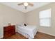 Bedroom with double bed, wood floors, and dresser at 2507 Hobblebrush Dr, North Port, FL 34289