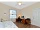 Bedroom with daybed, workspace, and ceiling fan at 2507 Hobblebrush Dr, North Port, FL 34289