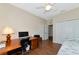 Bedroom with daybed, workspace, and ceiling fan at 2507 Hobblebrush Dr, North Port, FL 34289