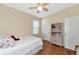 Bedroom with double bed, wood floors, and bookcase at 2507 Hobblebrush Dr, North Port, FL 34289