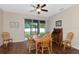 Dining area with wood table and chairs, hardwood floors and view of backyard at 2507 Hobblebrush Dr, North Port, FL 34289