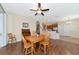 Bright dining room with wood table and chairs, hardwood floors and access to backyard at 2507 Hobblebrush Dr, North Port, FL 34289