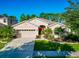 Attractive single-story house with a red door and well-manicured landscaping at 2507 Hobblebrush Dr, North Port, FL 34289