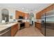 Spacious kitchen with stainless steel appliances and light wood cabinets at 2507 Hobblebrush Dr, North Port, FL 34289