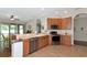 Eat-in kitchen featuring stainless steel appliances and wood cabinets at 2507 Hobblebrush Dr, North Port, FL 34289