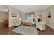 Spacious living room with hardwood floors, a neutral color palette, and access to the backyard at 2507 Hobblebrush Dr, North Port, FL 34289