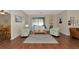 Bright and airy living room with hardwood floors, a neutral color palette, and access to the backyard at 2507 Hobblebrush Dr, North Port, FL 34289