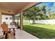 Screened porch overlooking a grassy backyard at 2507 Hobblebrush Dr, North Port, FL 34289