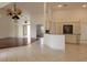 Open kitchen with granite counters and views of the living room at 264 Rotonda N Blvd, Rotonda West, FL 33947