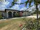 House exterior with a two-car garage and landscaped front yard at 283 White Marsh Ln, Rotonda West, FL 33947