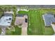 Bird's-eye view showcasing a single-story house, pool, and expansive grassy backyard at 31 Tee View Pl, Rotonda West, FL 33947