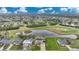 Aerial view of single-Gathering home with pool and large backyard, situated on a golf course at 31 Tee View Pl, Rotonda West, FL 33947