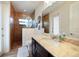 Guest bathroom with walk-in shower and granite countertop vanity at 31 Tee View Pl, Rotonda West, FL 33947