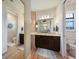 Bathroom with double vanity, granite countertop and large mirror at 31 Tee View Pl, Rotonda West, FL 33947