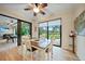 Casual breakfast nook with sliding doors leading to a pool and patio area at 31 Tee View Pl, Rotonda West, FL 33947