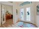 Bright entryway with double doors and view to an office at 31 Tee View Pl, Rotonda West, FL 33947